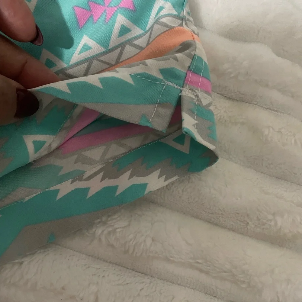 chubbies Turquoise Aztec Swim Trunks with Pink and Yellow Accents
